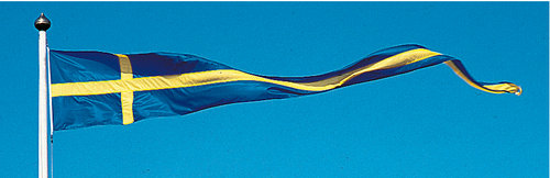 Korsvimpel fra Adela med Sveriges flag, der blafrer på en båd.